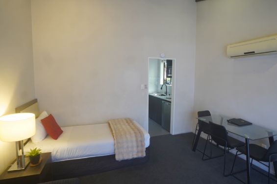 1-Bedroom Executive single bed and dining table